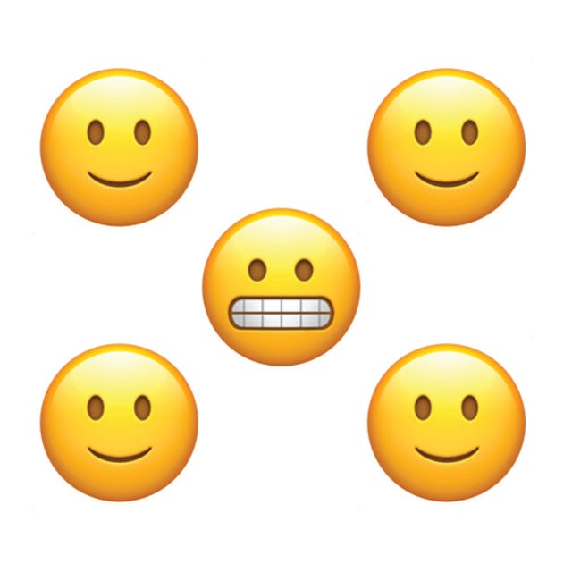 five emoji faces four smiling and one grinning nervously