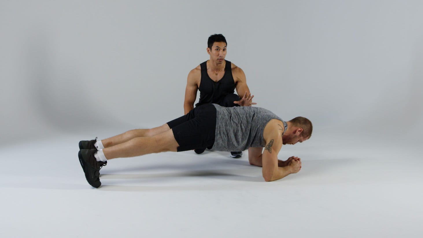 Which Carry Will Build Muscle Where You Want It?  two gym athletes doing farmers walk with kettlebells