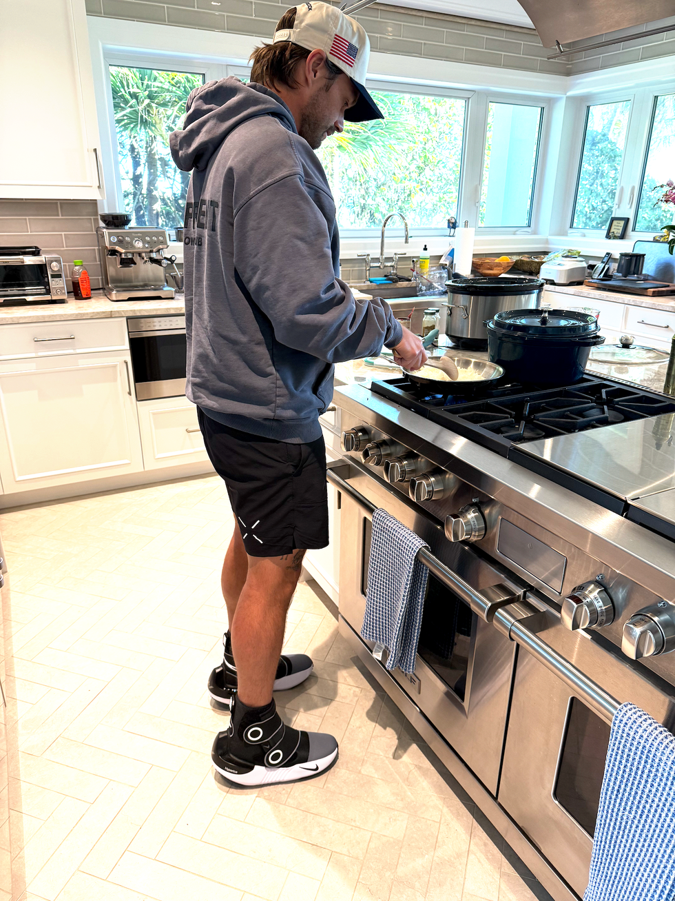 Person cooking in a modern kitchen.