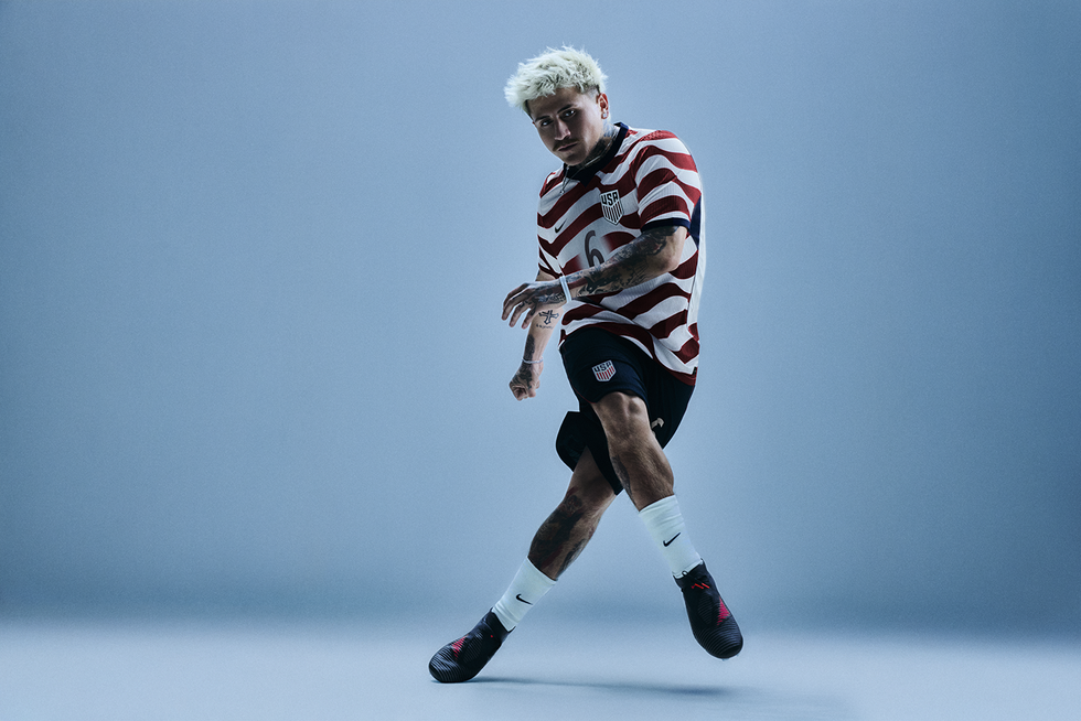 athlete in a soccer uniform performing an action