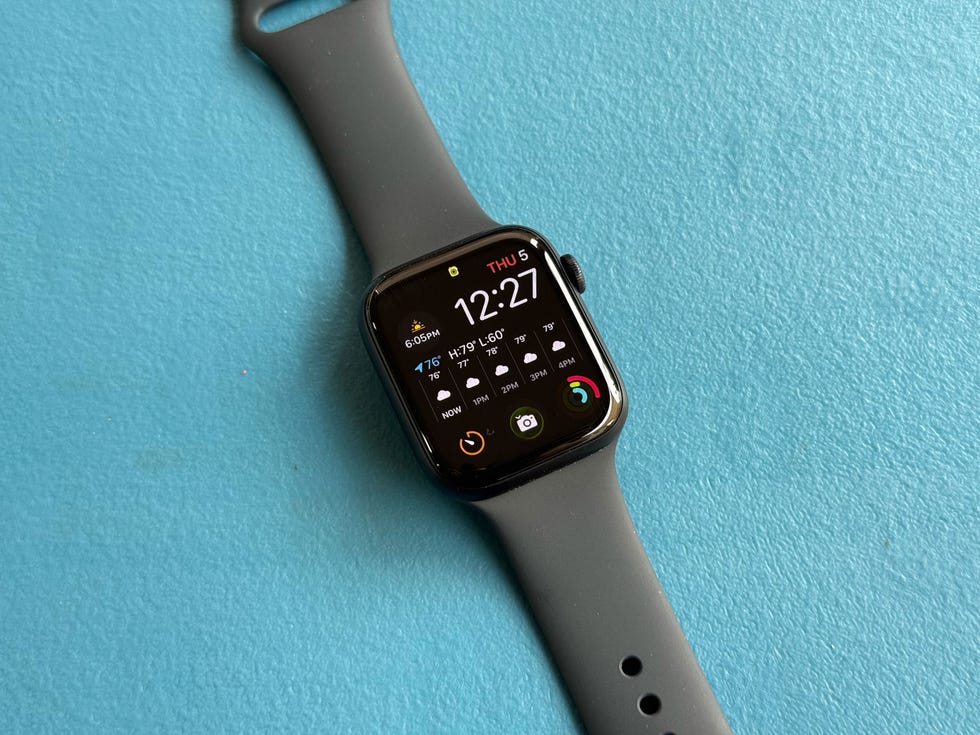 smartwatch displaying time and weather information