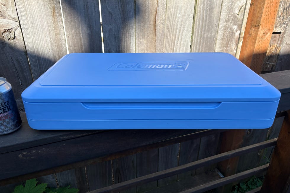 Blue storage container on a wooden surface.