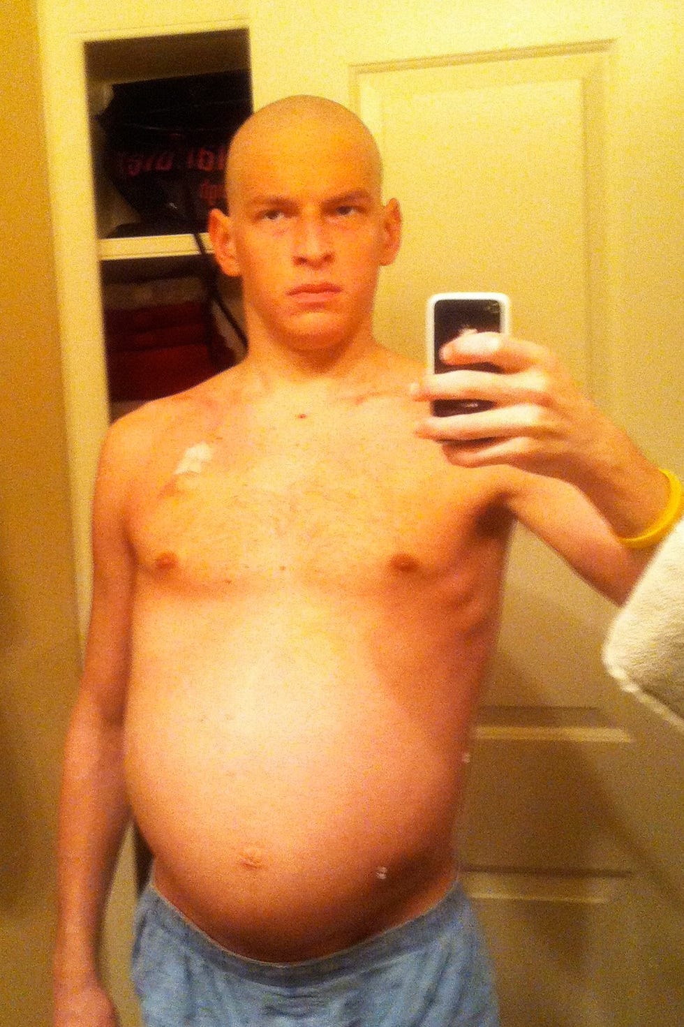 Self-portrait of a person in a bathroom.