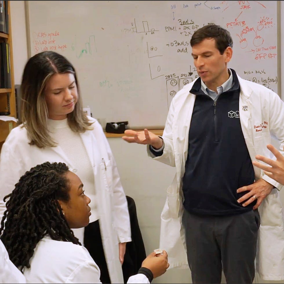 Group of professionals discussing in a lab environment.