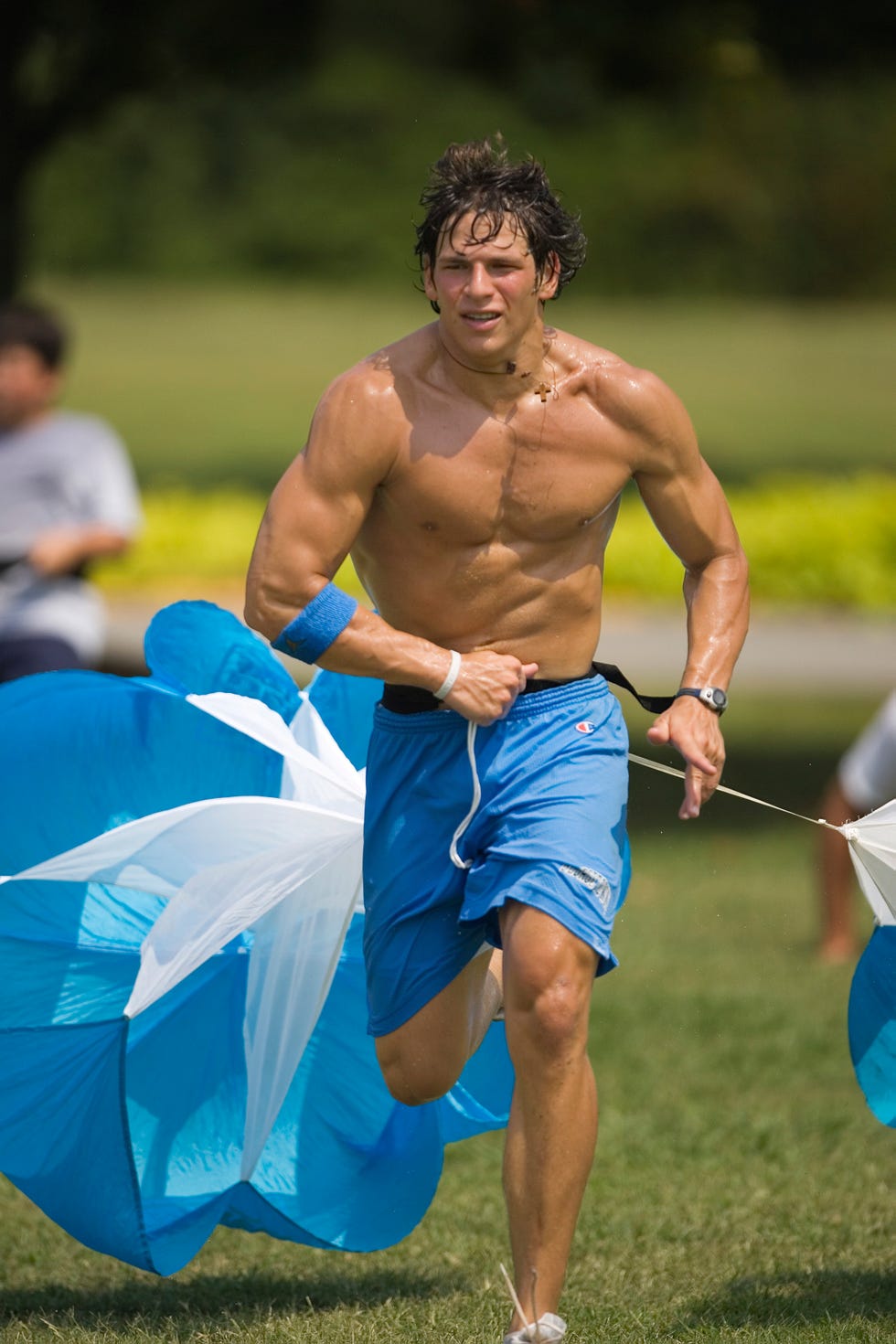David running with a parachute resistance trainer.