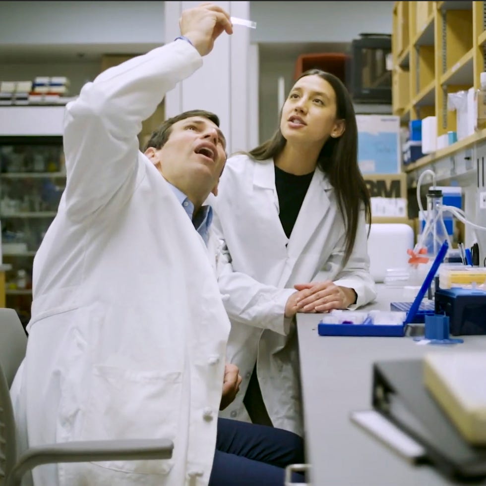 Laboratory scene with researchers conducting experiments.