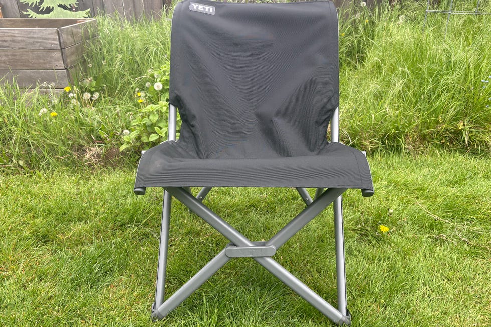Compact folding chair in outdoor setting