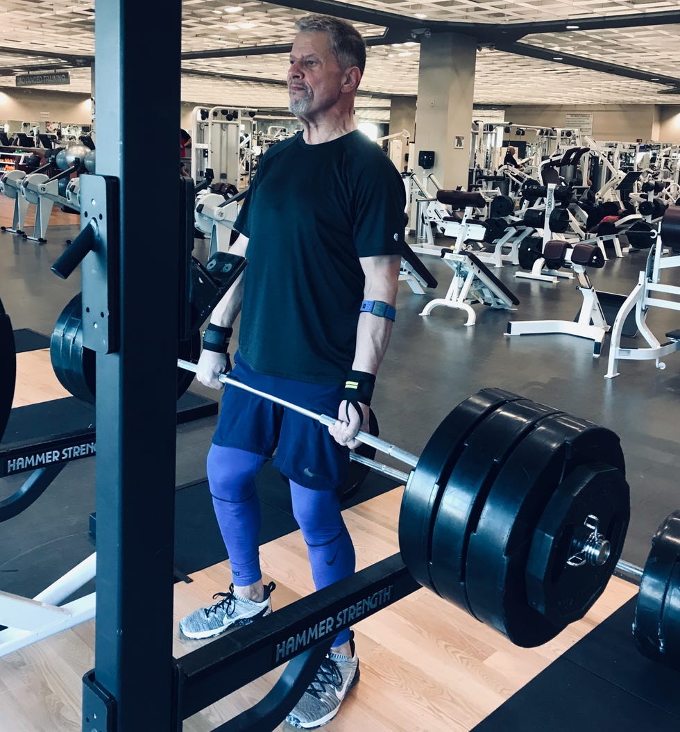 Glen Wagner deadlifting heavy weights in a gym setting