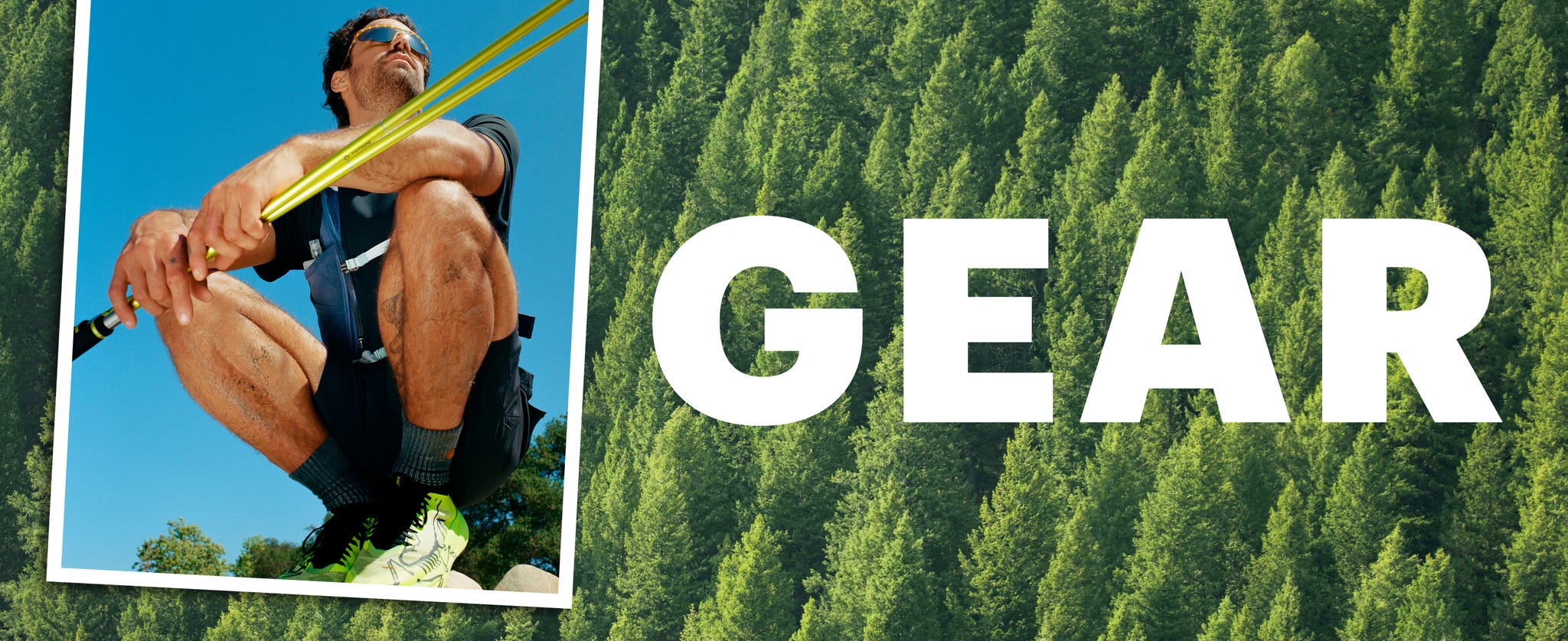 Man seated outdoors with gear, surrounded by trees, looking contemplative.