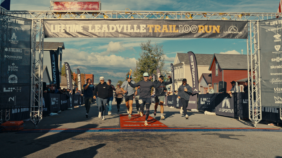 Runners celebrating as they cross the finish line at the Leadville Trail 100 Run event.