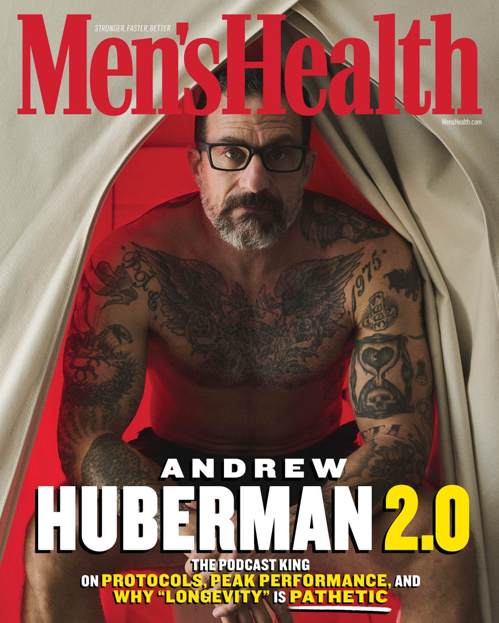 Andrew Huberman featured on the cover of Men's Health, showcasing tattoos and glasses, discussing health and performance.