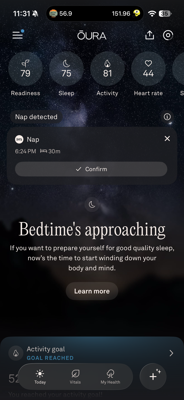 Oura app displaying nap detection and readiness, sleep, and activity metrics against a starry background.